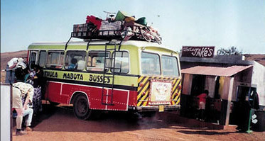 African retro bus scene propped dressed and ready